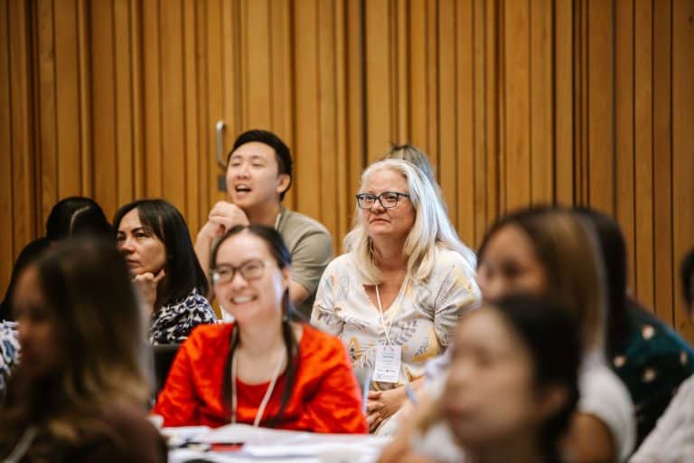 Diverse group of professionals engaged during the VFLI Conference 2026 session.