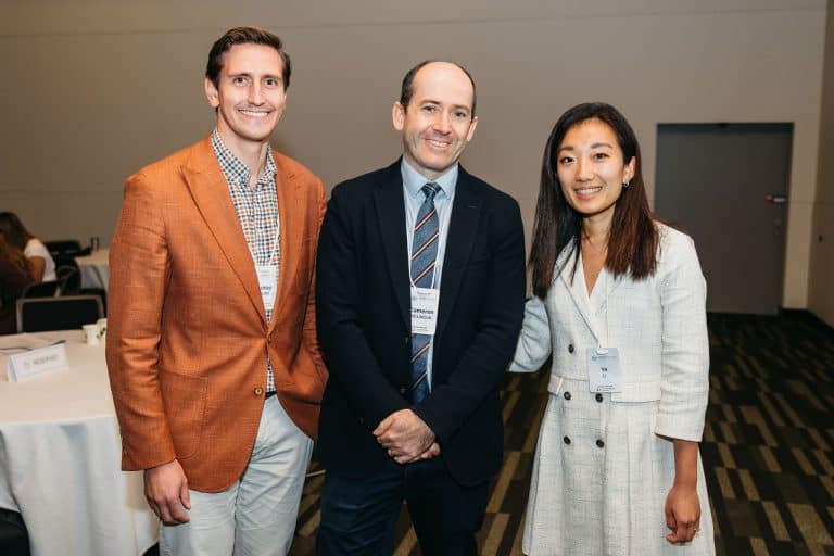 Three professionals smiling at the VFLI Conference Highlights 2026 event.